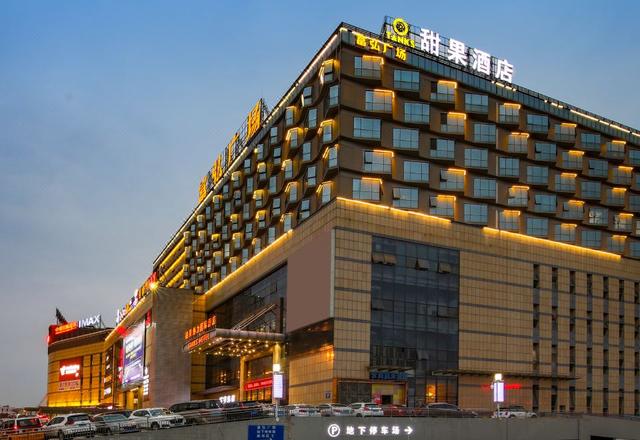 Sweet Fruit Charm International Hotel (Foshan West Railway Station Luocun Branch)